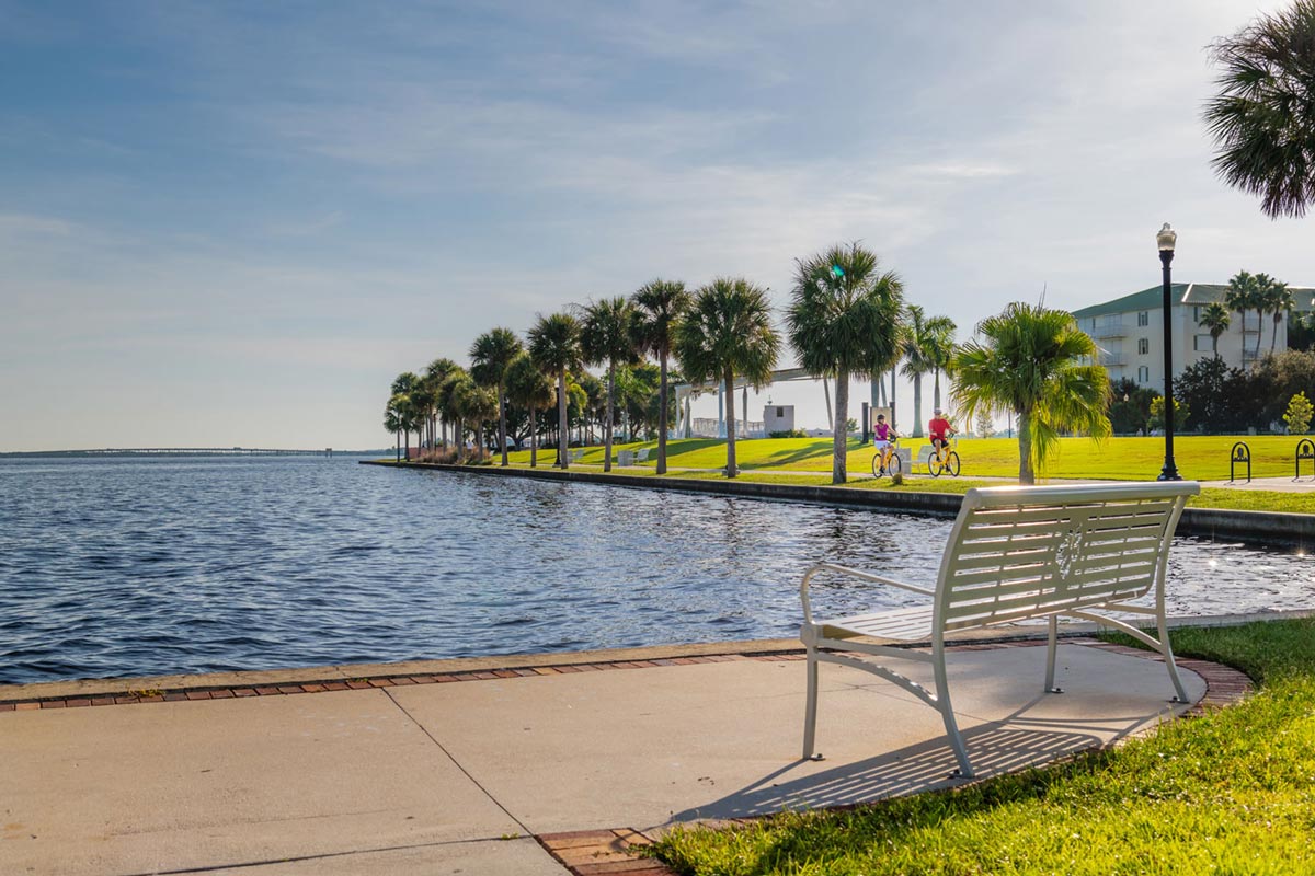 Punta Gorda Couple Biking by Waterfront